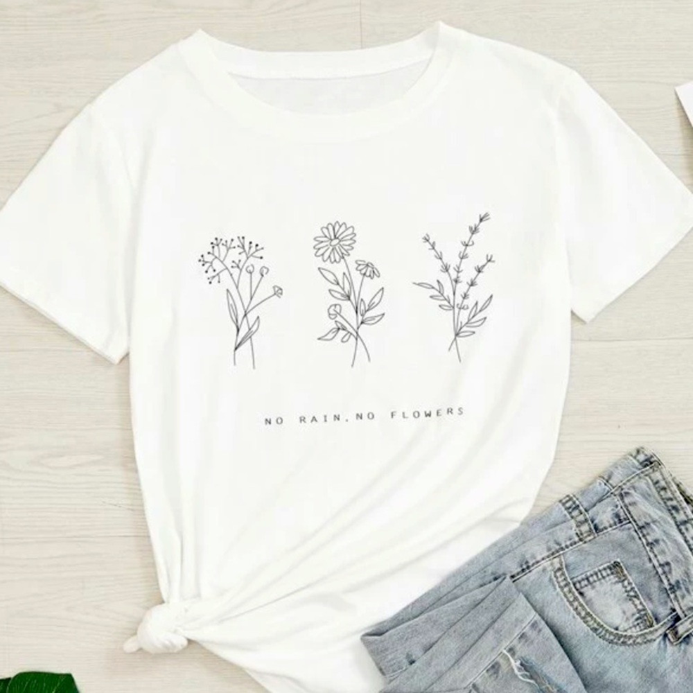I am selling a white shirt with flower prints. This shirt is from SHEIN.